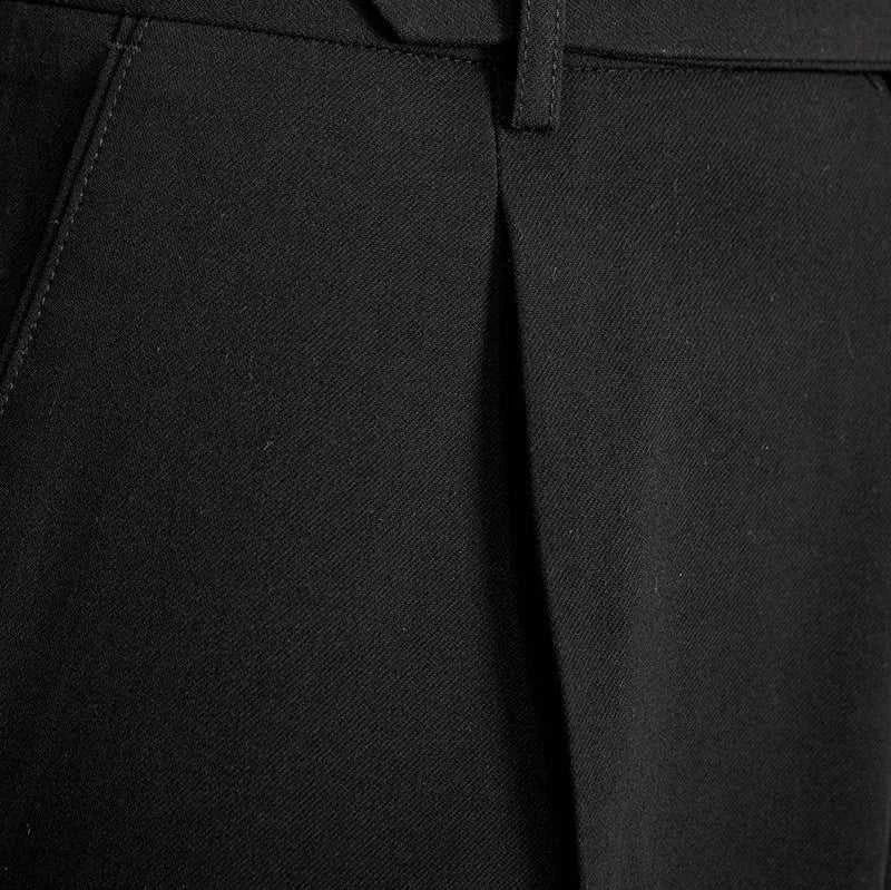 Close-up of Italian straight style elegant pants in black polyester fabric.