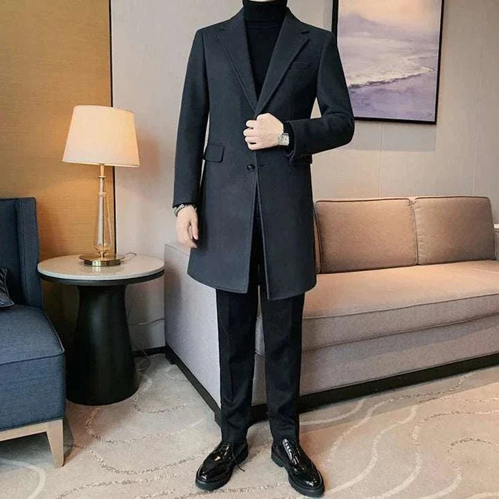 Elegant slim fit suit coat for men in a modern living room setting.