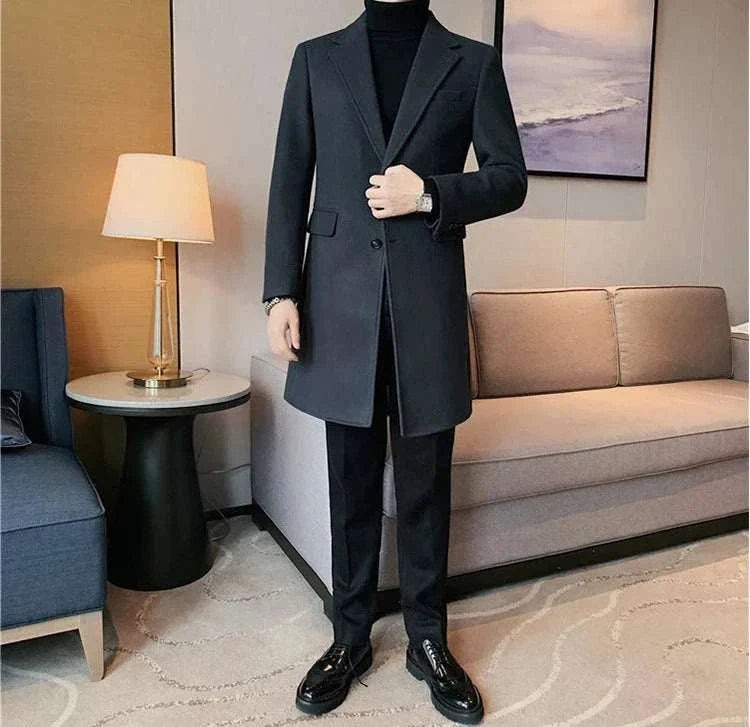 Elegant slim fit suit coat for men in a modern living room setting.