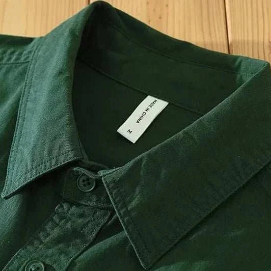 Pure cotton casual spring shirt in solid green color for men.
