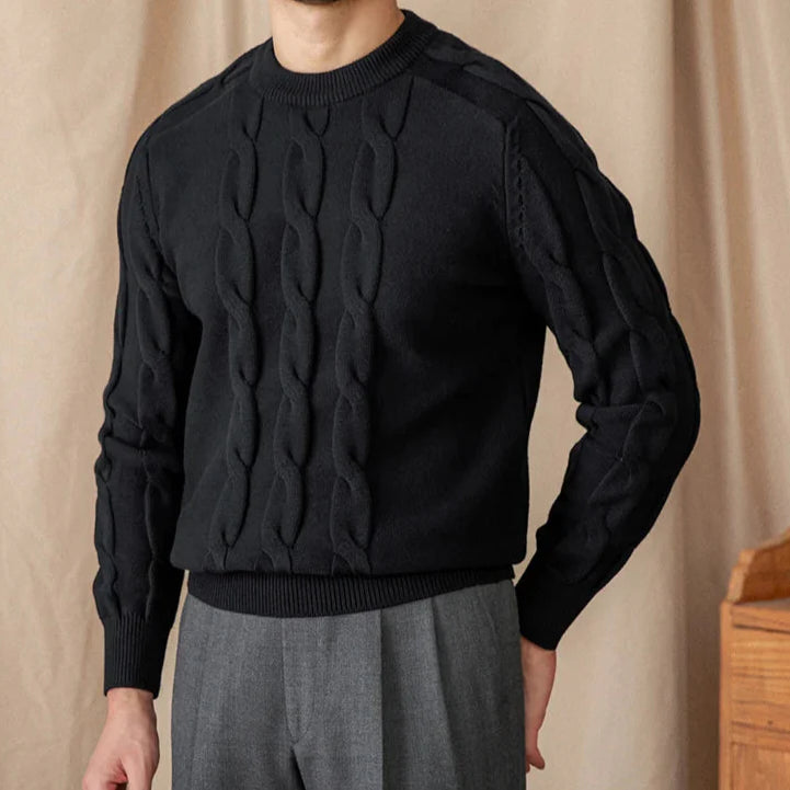 Men's round neck vintage sweater in black with a cable knit pattern.