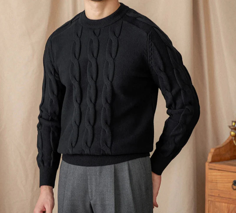 Men's round neck vintage sweater in black with a cable knit pattern.