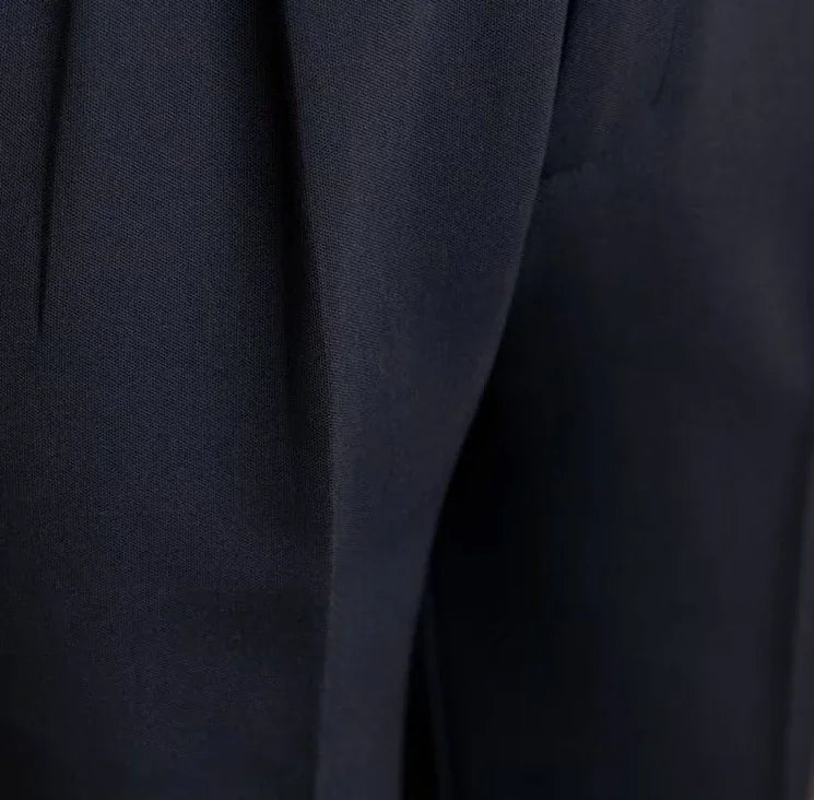 Antonios draped suit pants Korean-inspired elegance close-up showing fabric texture.