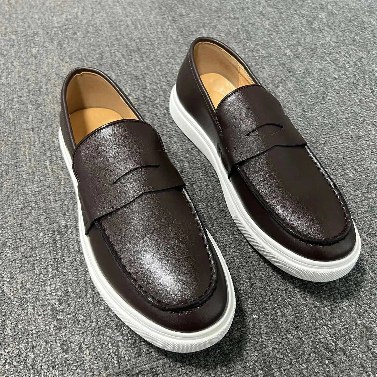 Casual slip loafers with luxurious suede, elastic side panels, and cushioned insole for comfort.