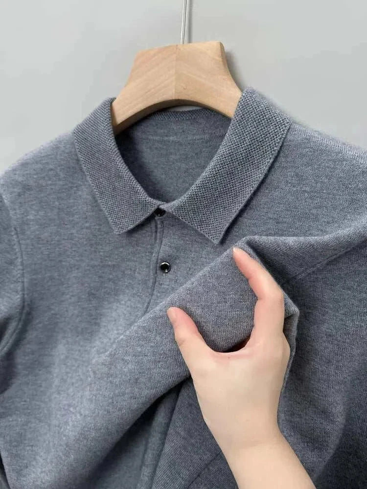 Gray Antonios polo sweater with buttons on a hanger, close-up view.