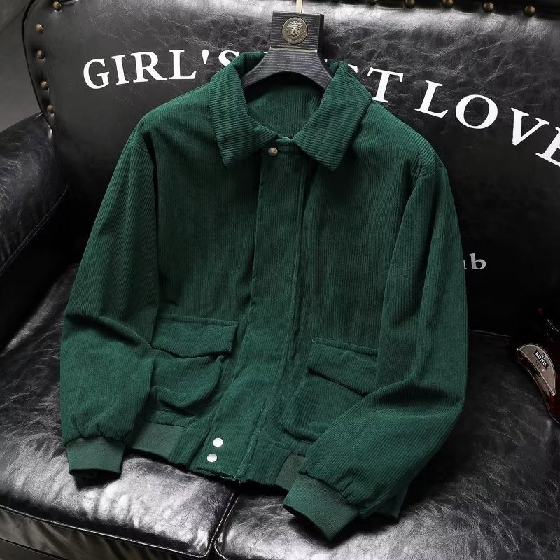 Men's green corduroy casual jacket on leather chair.