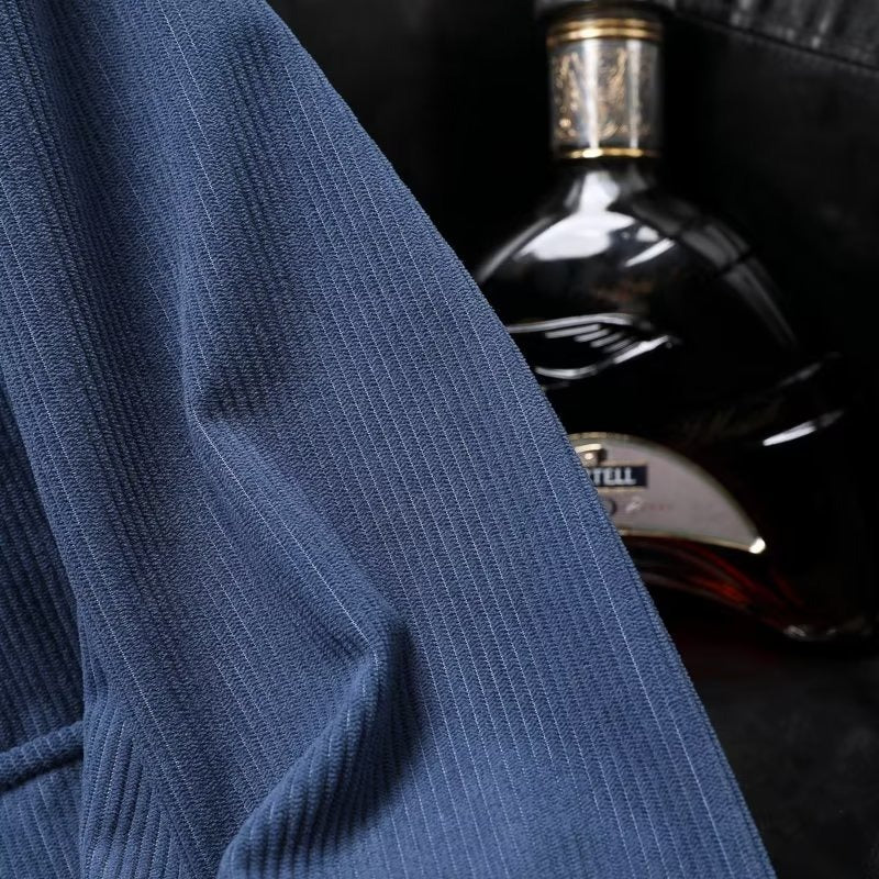 Blue corduroy texture on a casual jacket for men, suitable for all seasons.