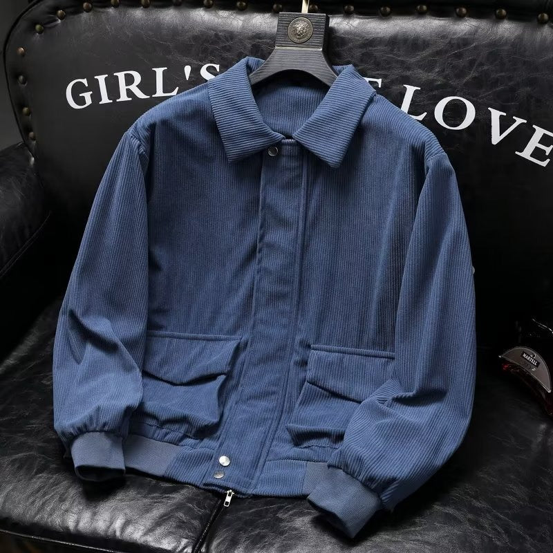 Men's blue corduroy casual jacket, suitable for all seasons, displayed on black leather background.
