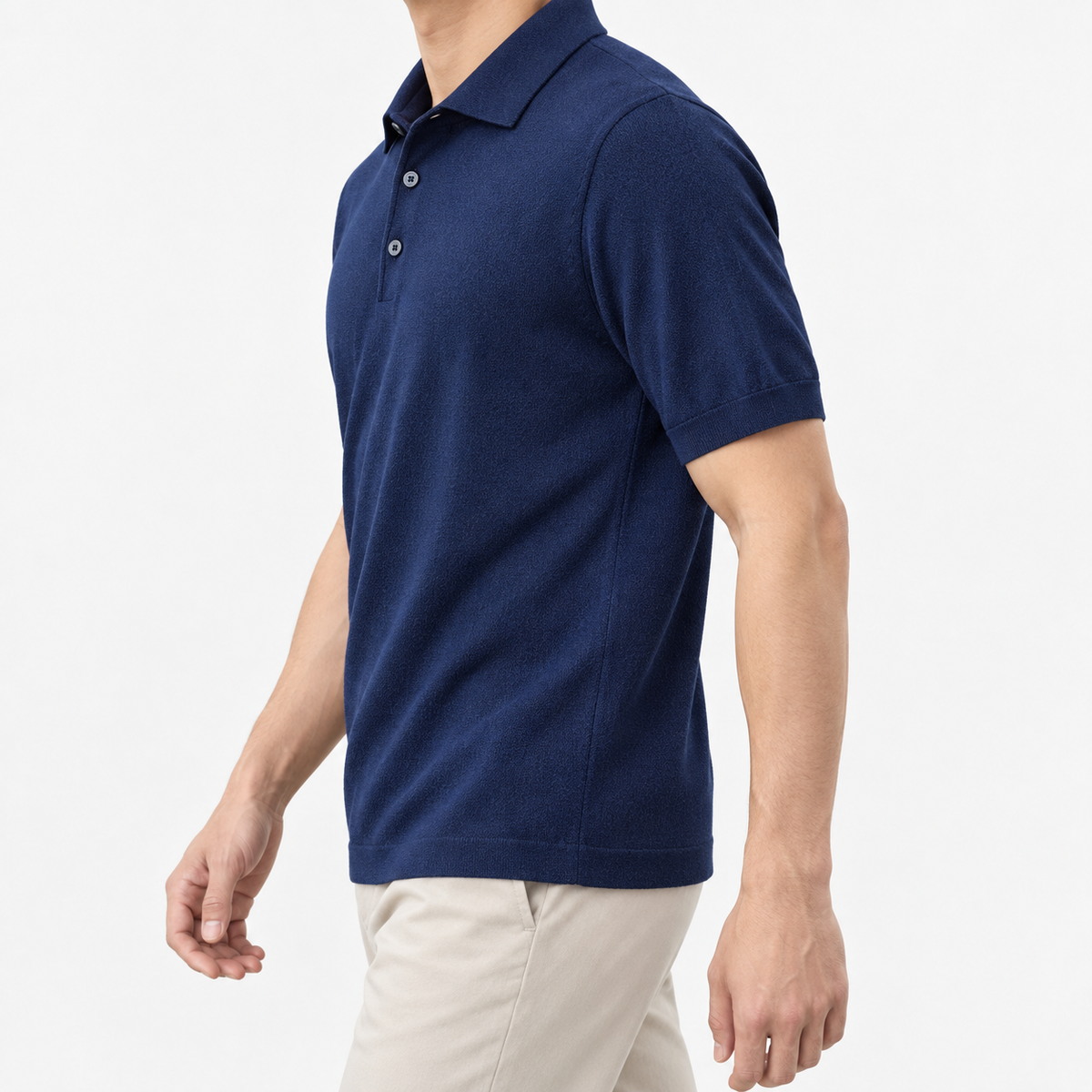 Lyocell silk polo with a fine textured knit in navy blue, three-quarter model view