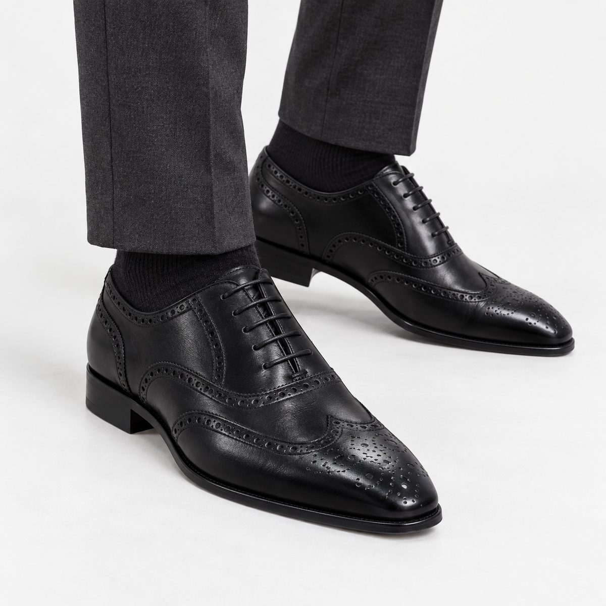 Leonardo genuine leather brogue shoes in black, side worn view