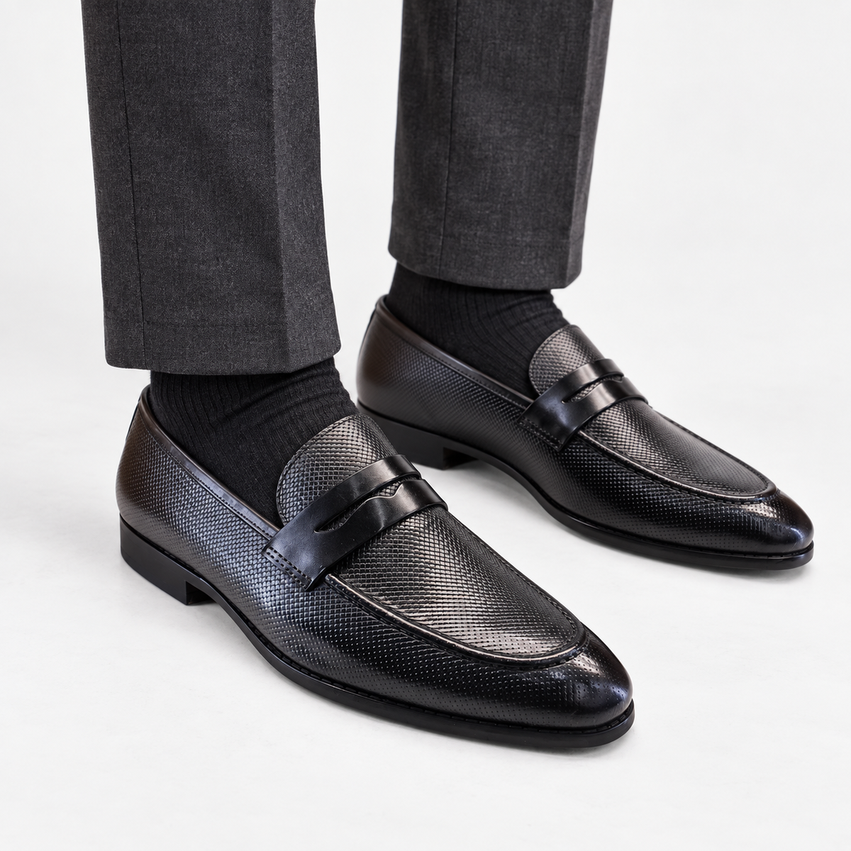 Leonardo genuine leather penny loafers in black, front worn view