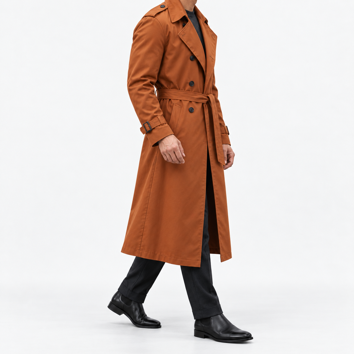 Long double breasted trench coat with a belt in burnt orange — side view on a male model