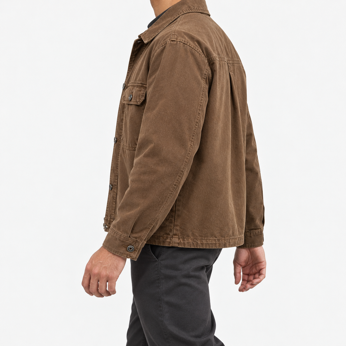 Washed cotton utility jacket with a zip front in brown — side view on a male model