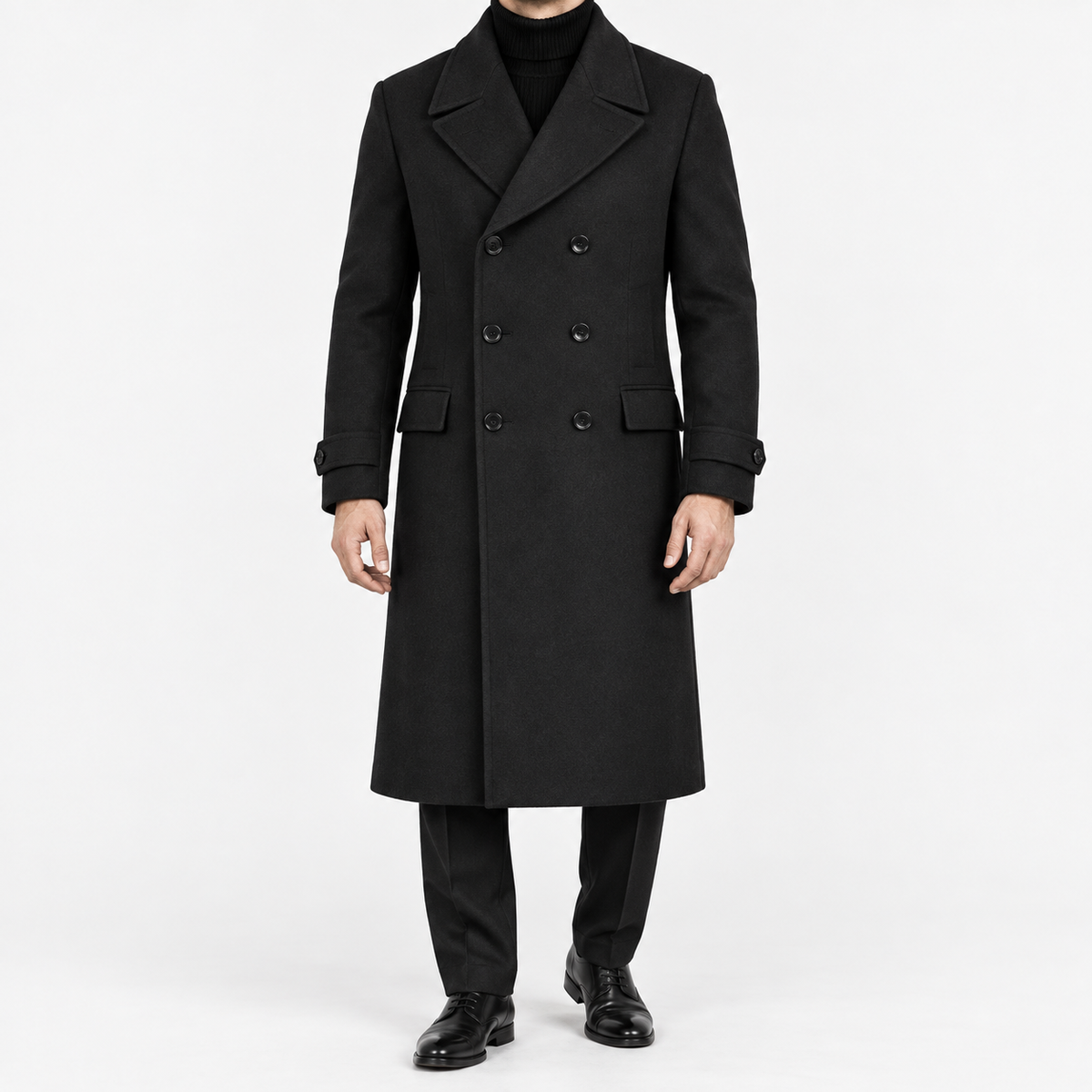 Long double breasted wool blend coat with cuff tabs in black — male model front view