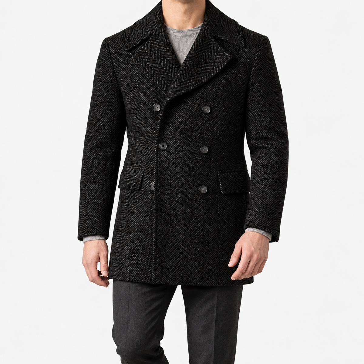 Herringbone double breasted coat with wide lapels in black — male model front view