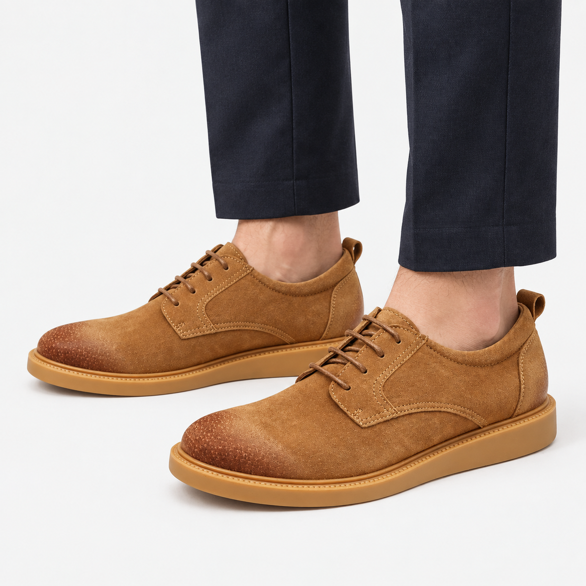Distressed derby shoes with flexible soles in tan, side view on a model