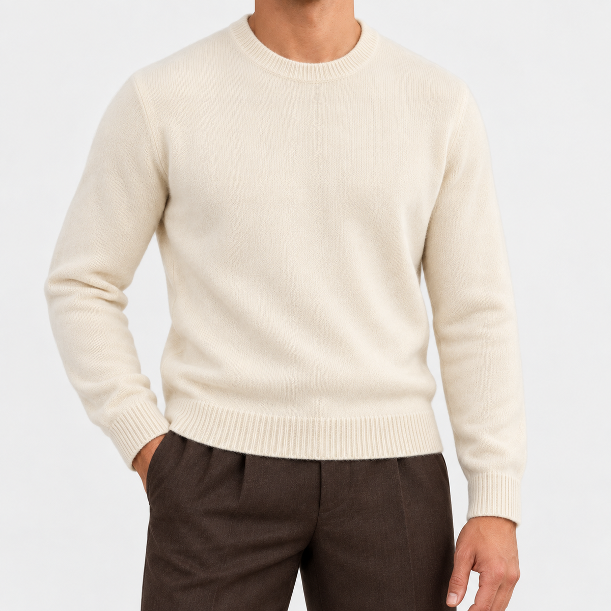 Fine knit wool crew neck sweater in cream, front view on a model