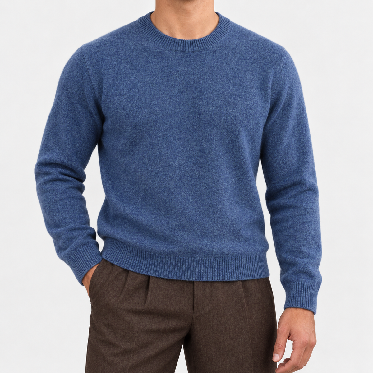 Fine knit wool crew neck sweater in denim blue, front view on a model