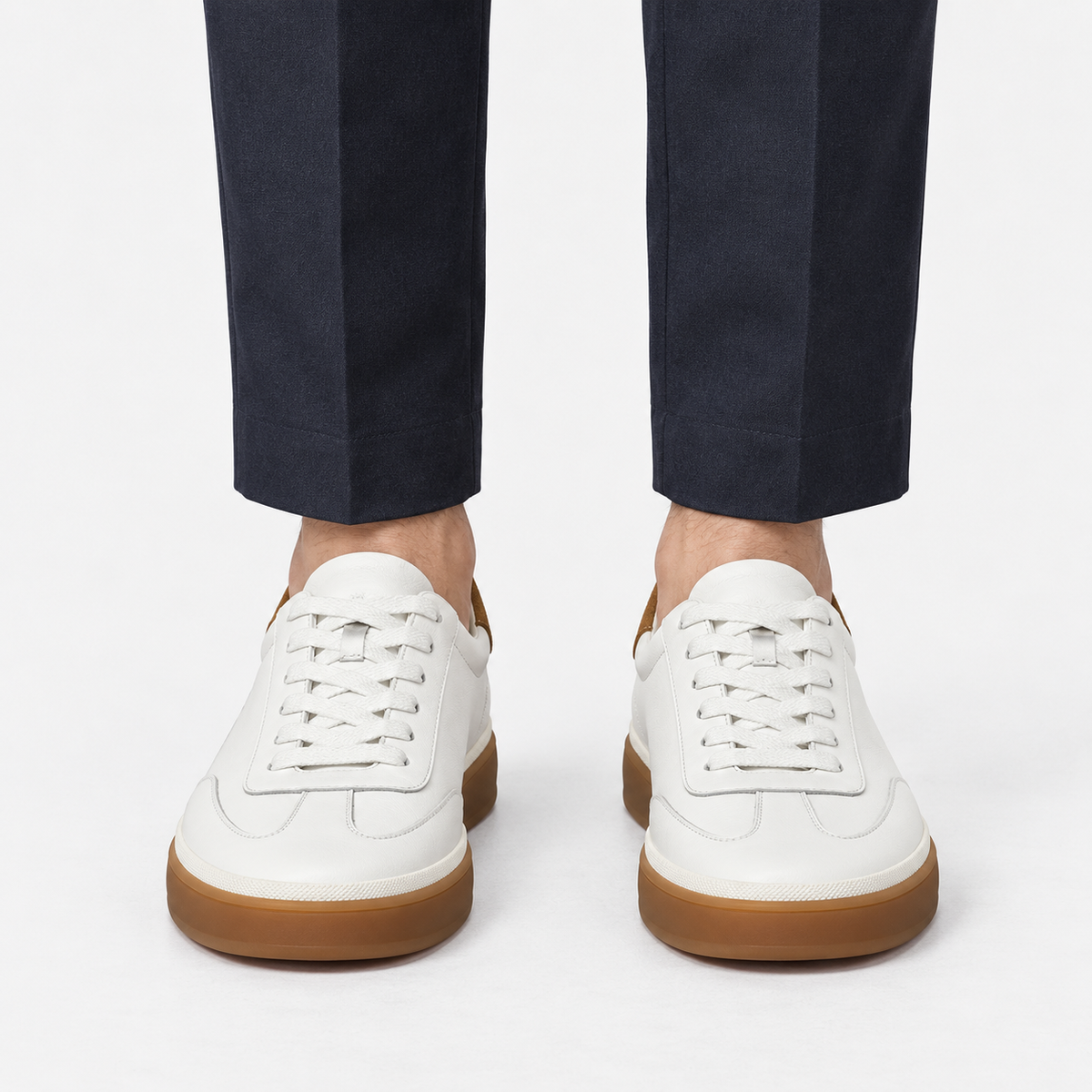 Leather court sneakers with gum soles in white, front view on a model