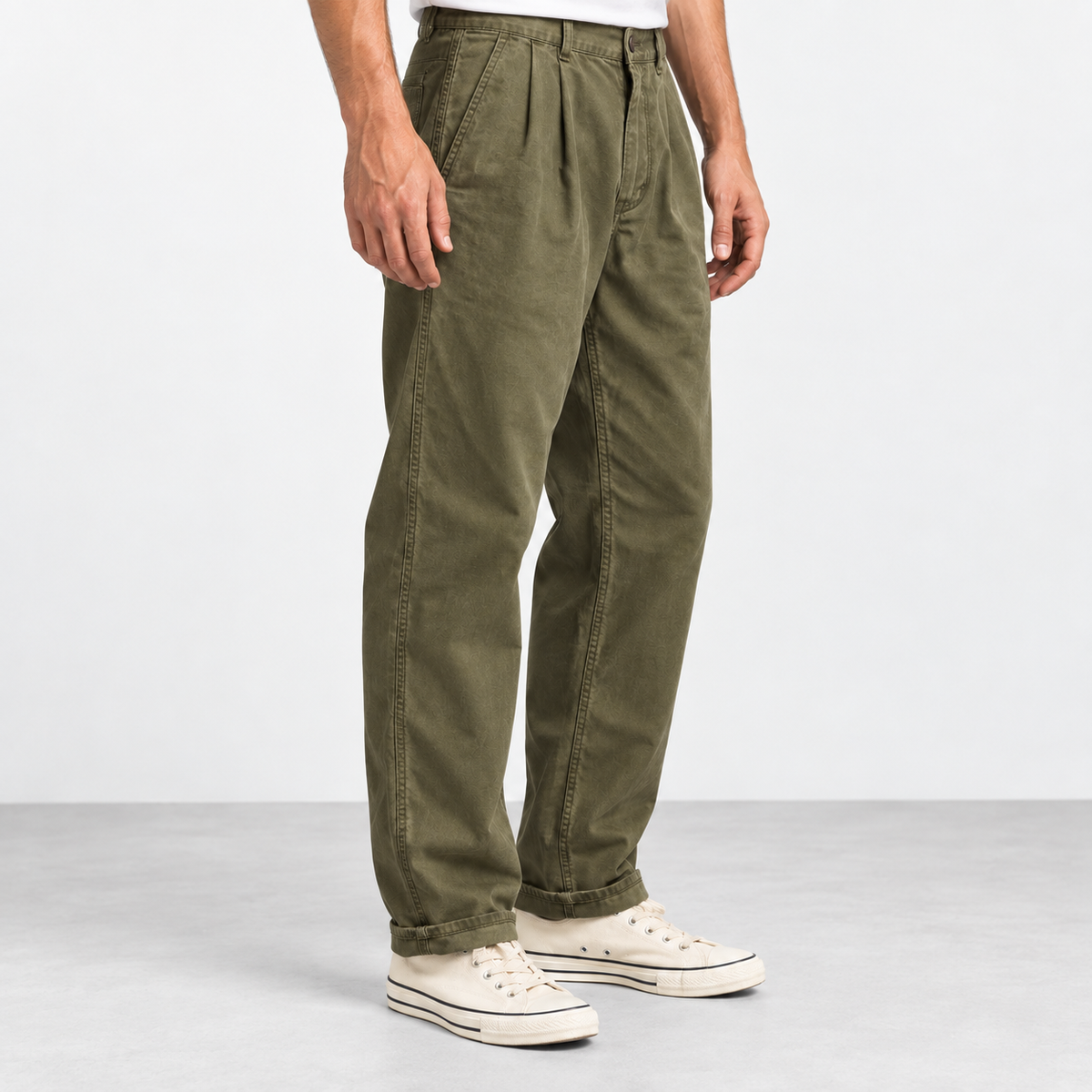 Pleated cotton utility trousers in army green, side view on a model
