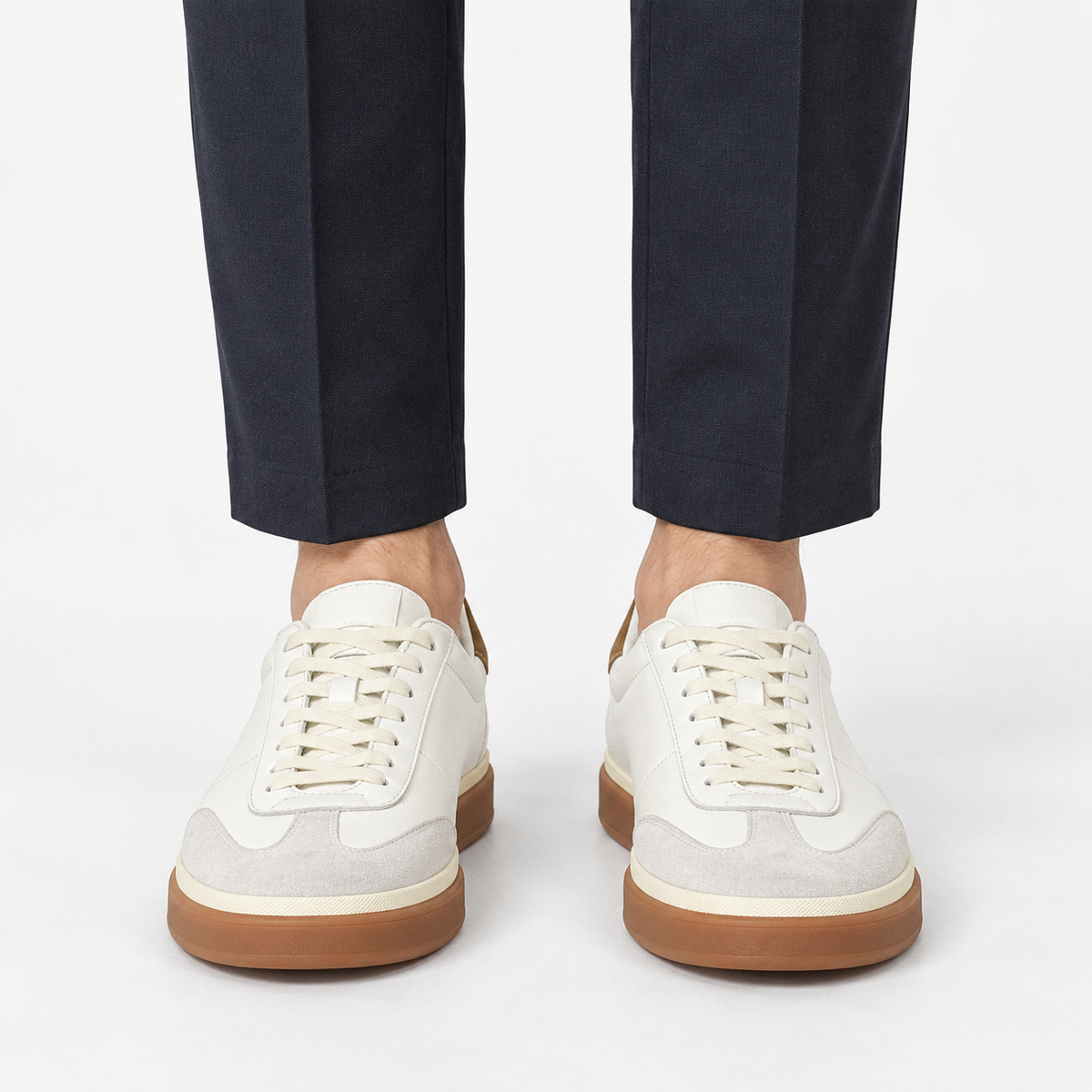 Retro leather sneakers with contrast soles in white gum sole, front view on a model