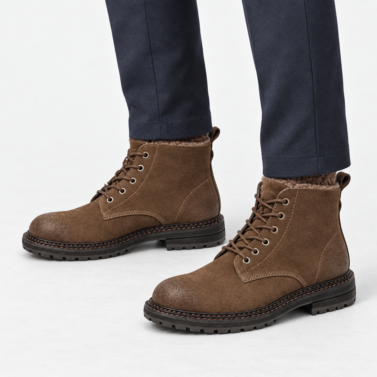Rough suede lace up ankle boots in brown fleece lined, side view on a model