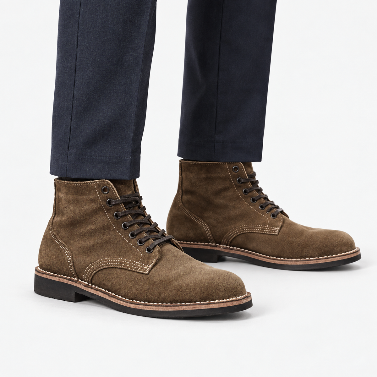 Suede plain toe lace up ankle boots in brown, side view on a model