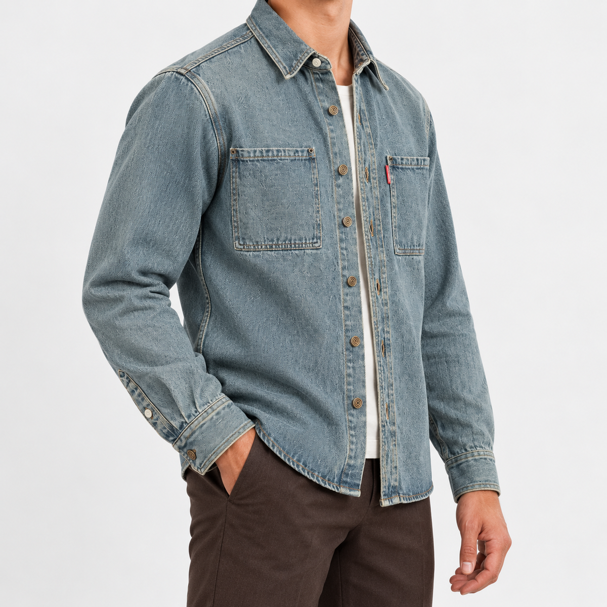 Washed denim twin pocket shirt in washed gray blue, side view on a model