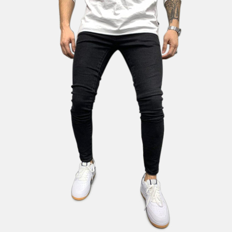 Antonios Ben Skinny Jeans for men in black denim, styled casually with white sneakers.