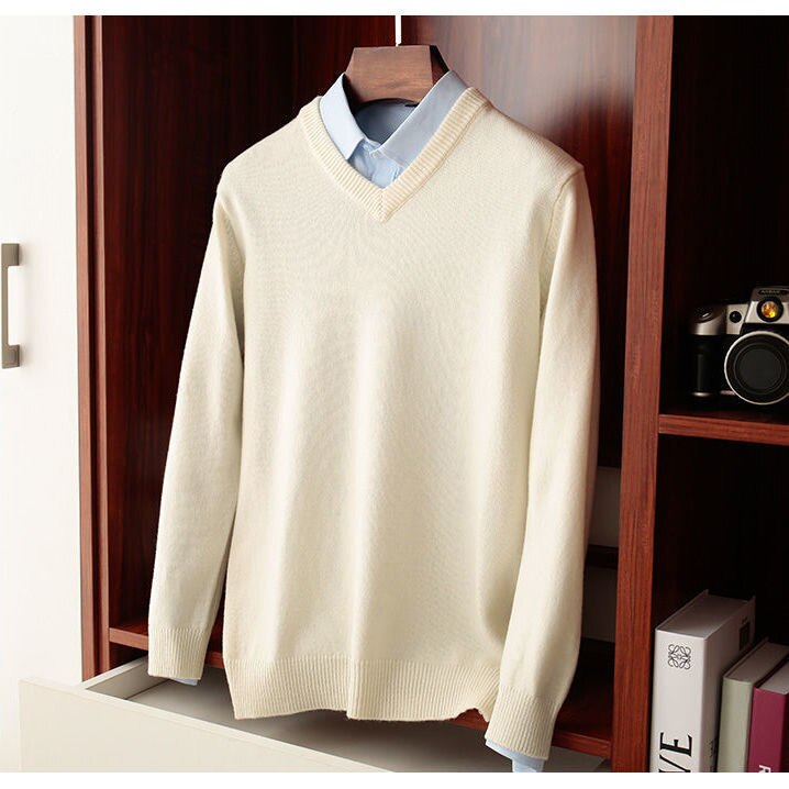 Men's beige wool V-neck sweater from Antonios Wool Winter collection hanging on a shelf.