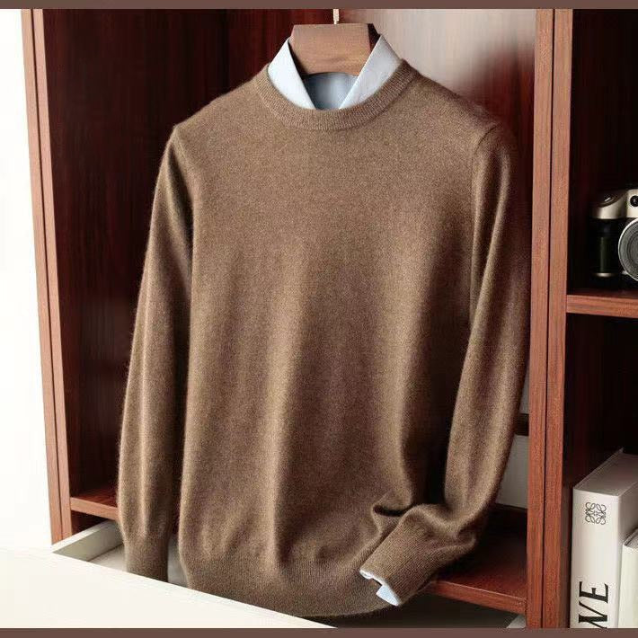 Brown knitted sweater for men displayed on a shelf, featuring a round collar and casual style.