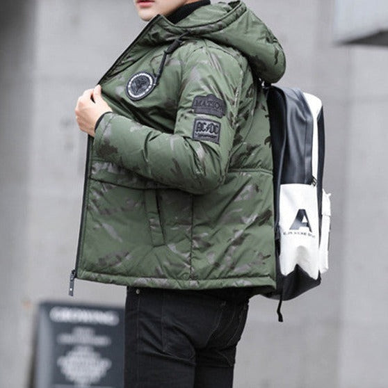 Antonios Camouflage Pattern Winter Jacket in green, worn by man, side view with hood and patches visible.