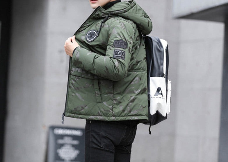 Antonios Camouflage Pattern Winter Jacket in green, worn by man, side view with hood and patches visible.