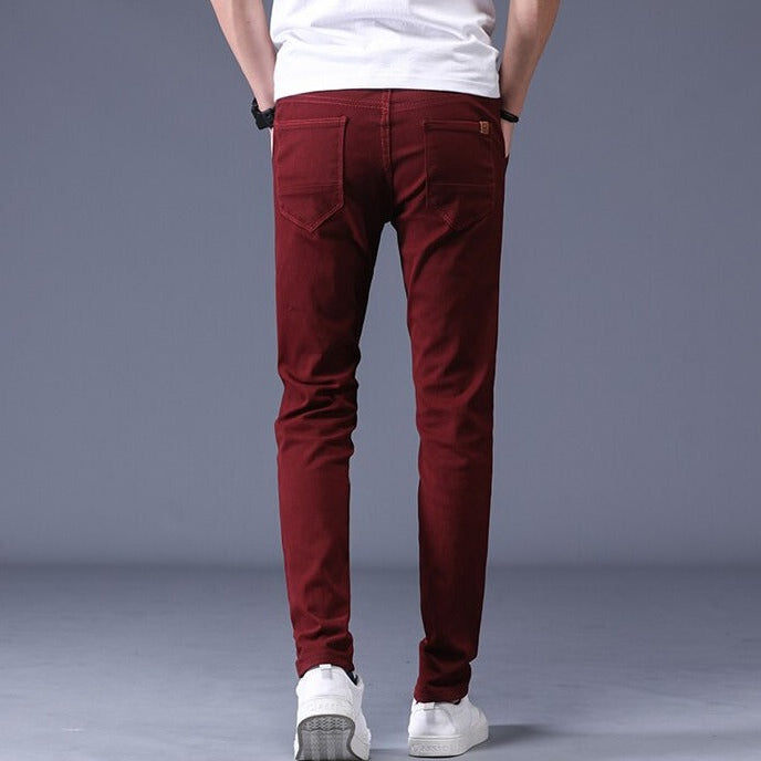 Antonios Slim Fit Cotton Stretch Trousers Men in burgundy, shown from the back, styled with white sneakers.