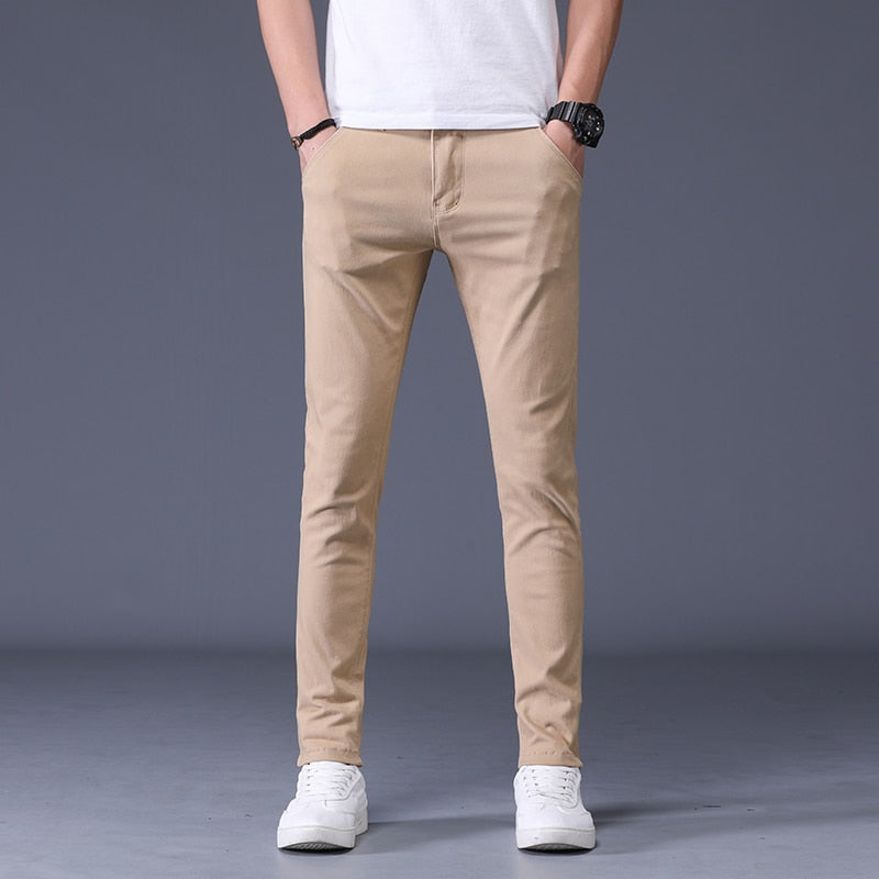 Antonios Slim Fit Cotton Stretch Trousers in beige worn by model, showcasing modern vintage style.
