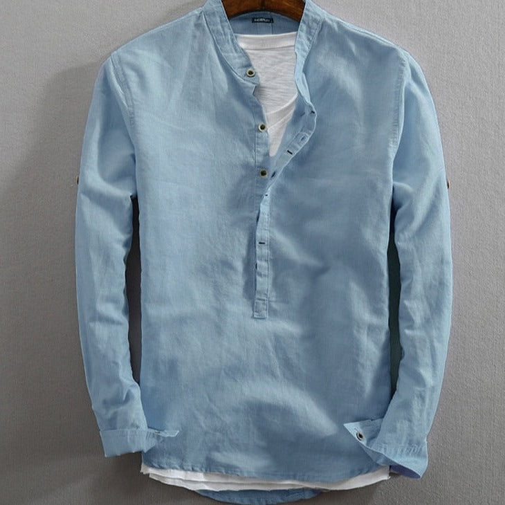 Elegant light blue long-sleeve men's shirt by AntoniosClothing, featuring organic cotton blend and classic collar.