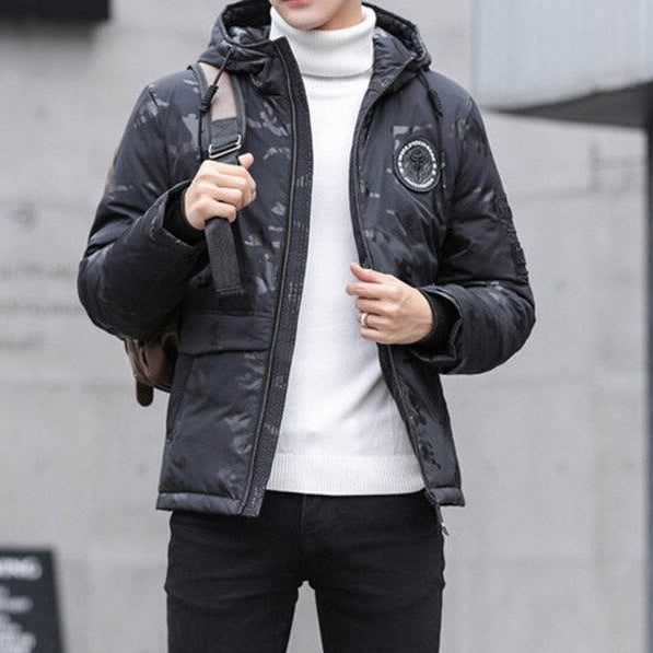 Antonios Camouflage Pattern Winter Jacket in black, worn by a man, featuring a hooded design and casual style.