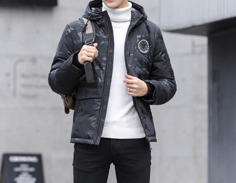 Antonios Camouflage Pattern Winter Jacket in black, worn by a man, featuring a hooded design and casual style.