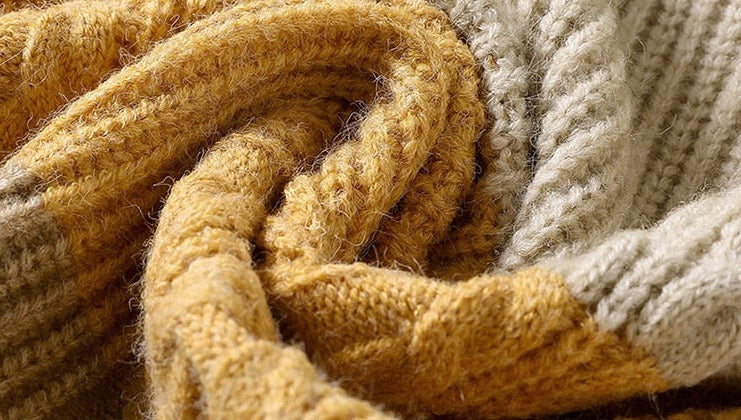 Cozy wool and viscose fabric of Antonios Large Winter Sweater in yellow and beige.