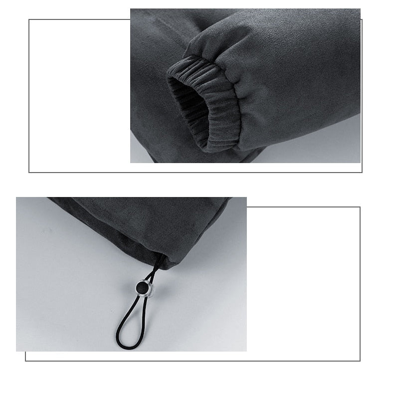 Men's dark grey faux suede puffer jacket detail with elastic cuff and drawstring.