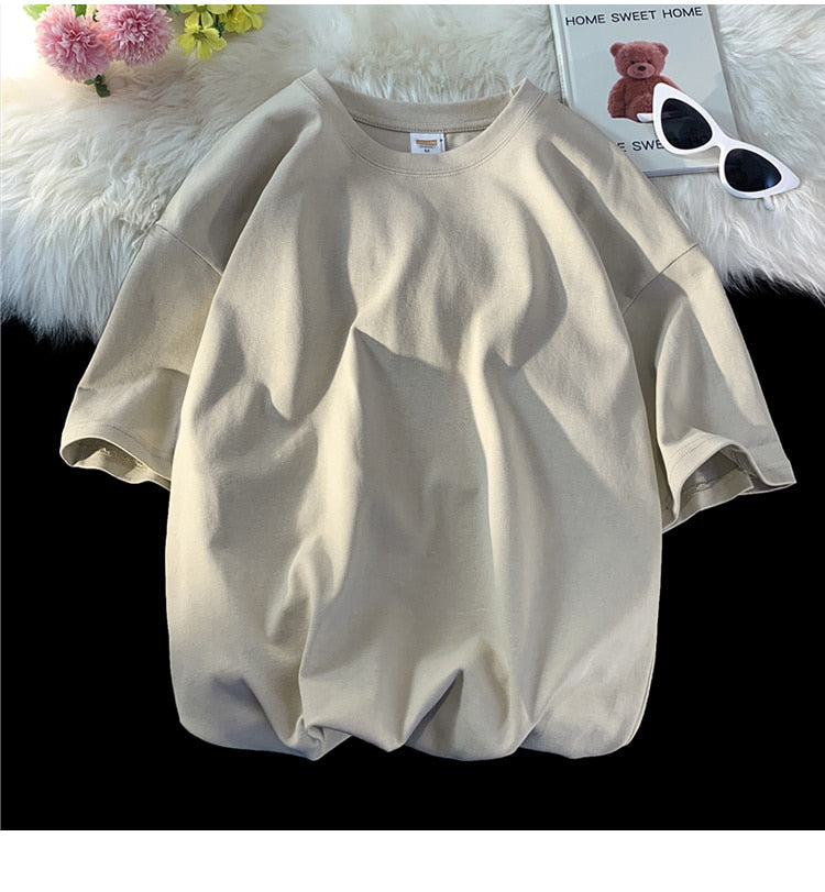 Antonios Oversized Casual Cotton T-Shirt in beige color on display with sunglasses and magazine.