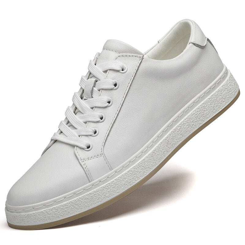 White casual shoes with genuine leather and lace-up design.