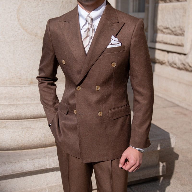 Brown Antonios Double Breast Suit worn by man, featuring a solid pattern and elegant design for business or events.
