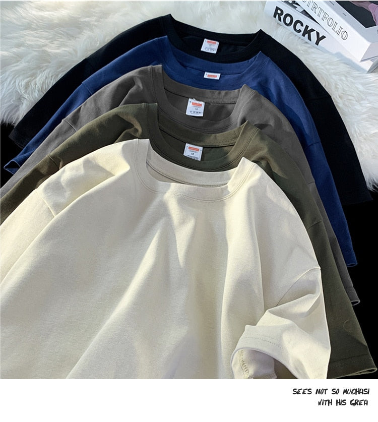 Antonios Oversized Casual Cotton T-Shirt in assorted colors stacked on display.
