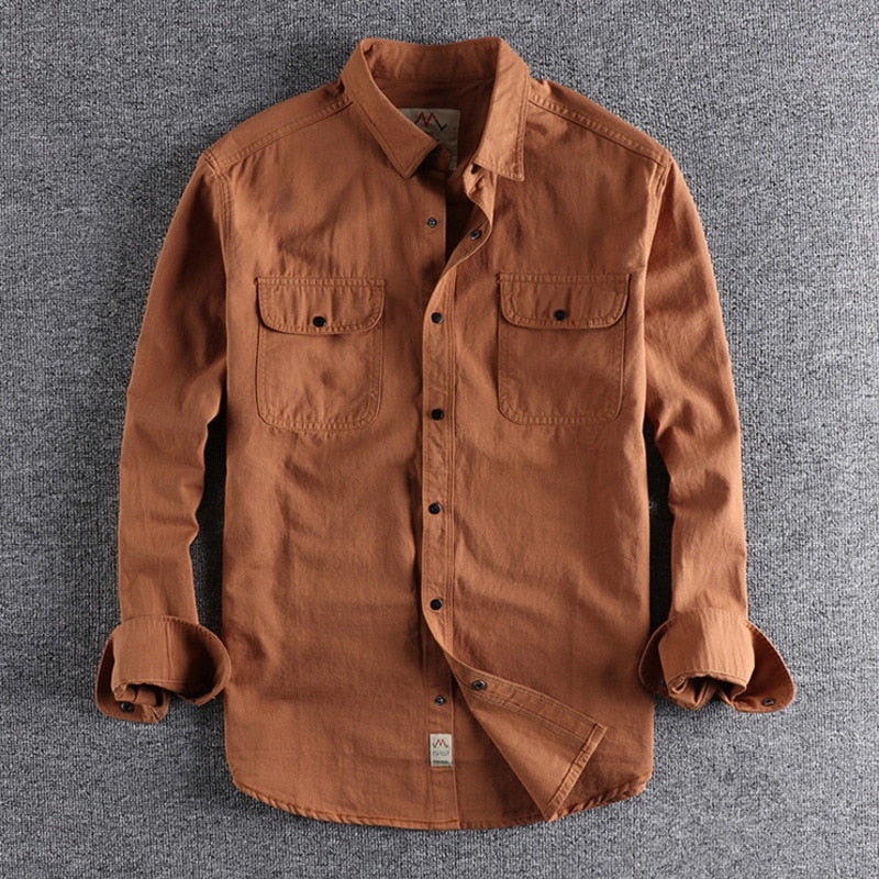 Vintage-Retro Cotton Shirt for Men on gray background, featuring long sleeves and button-down design.