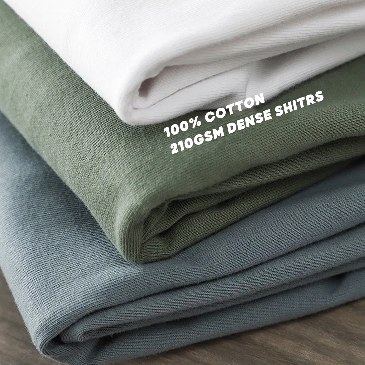 Stack of folded Antonios Oversized Casual Cotton T-Shirts, featuring premium heavyweight 100% cotton fabric.