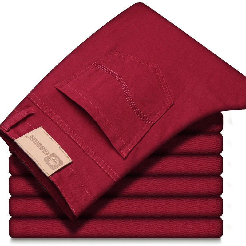 Red folded jeans with pocket detail on top, showcasing stylish casual wear.