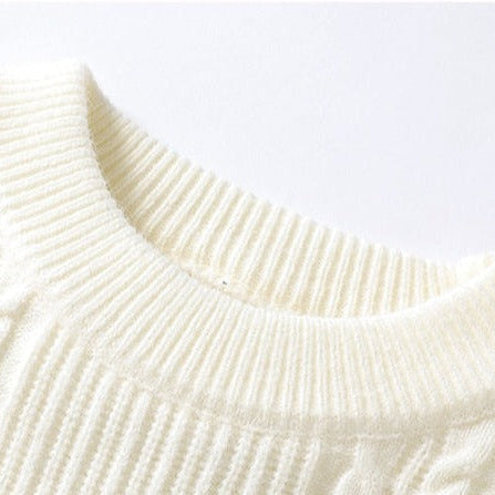 Cream-colored knitted sweater close-up - Antonios Large Winter Sweater.