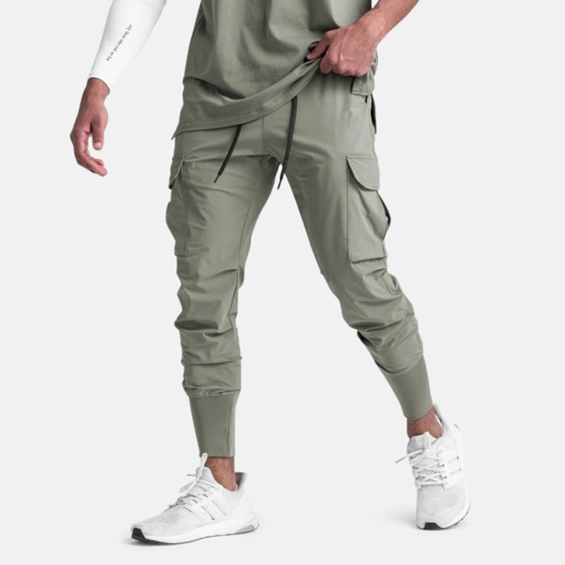 Men wearing green Antonios Sport Street Joggers with white sneakers.