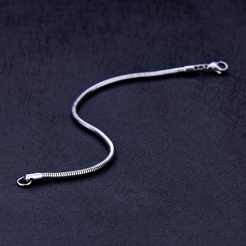 Antonios Snake Stainless Steel Bracelet with silver plating on a dark background.